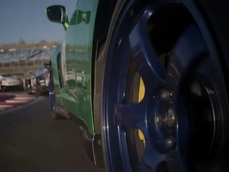 Everygen AI third-party low-angle scene of a moving car wheel